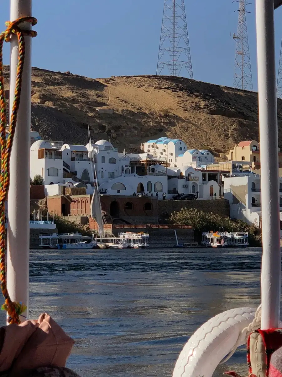 Sailing past the granite islands of Aswan toward a Nubian village